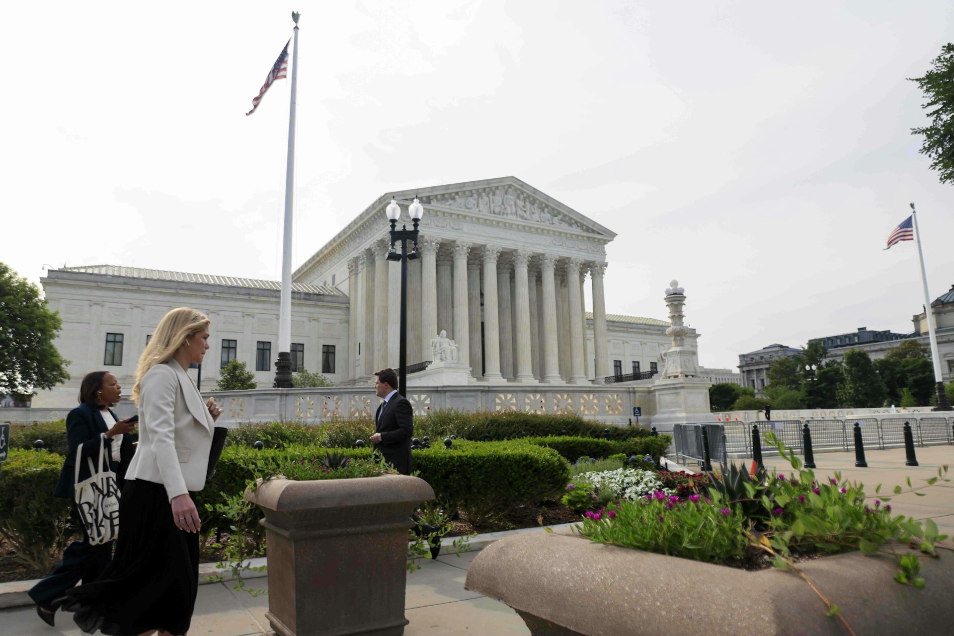 People walk near the US Supreme Court building in Washington DC..