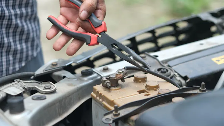 Hand holding pliers