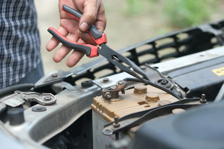 Hand holding pliers