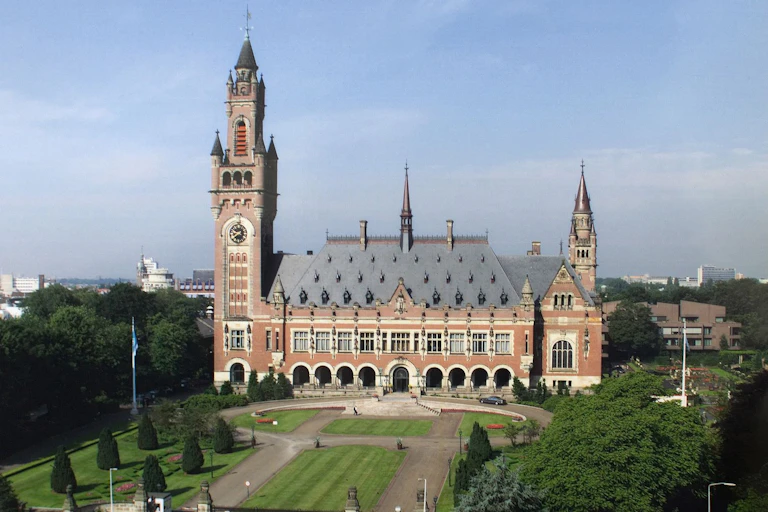 A large building with a large lawn in front of it