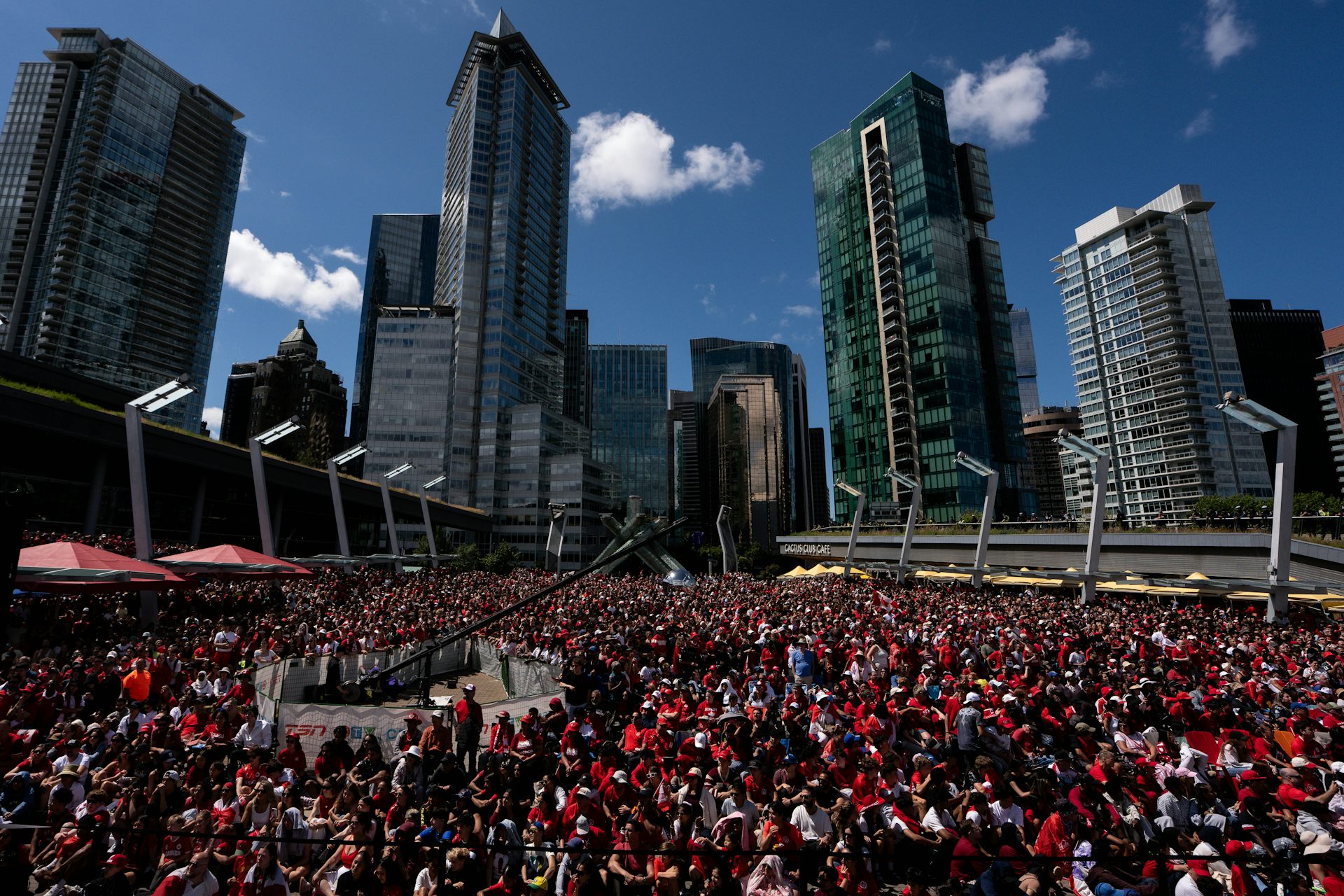 A massive crowd of people decked out in white and red