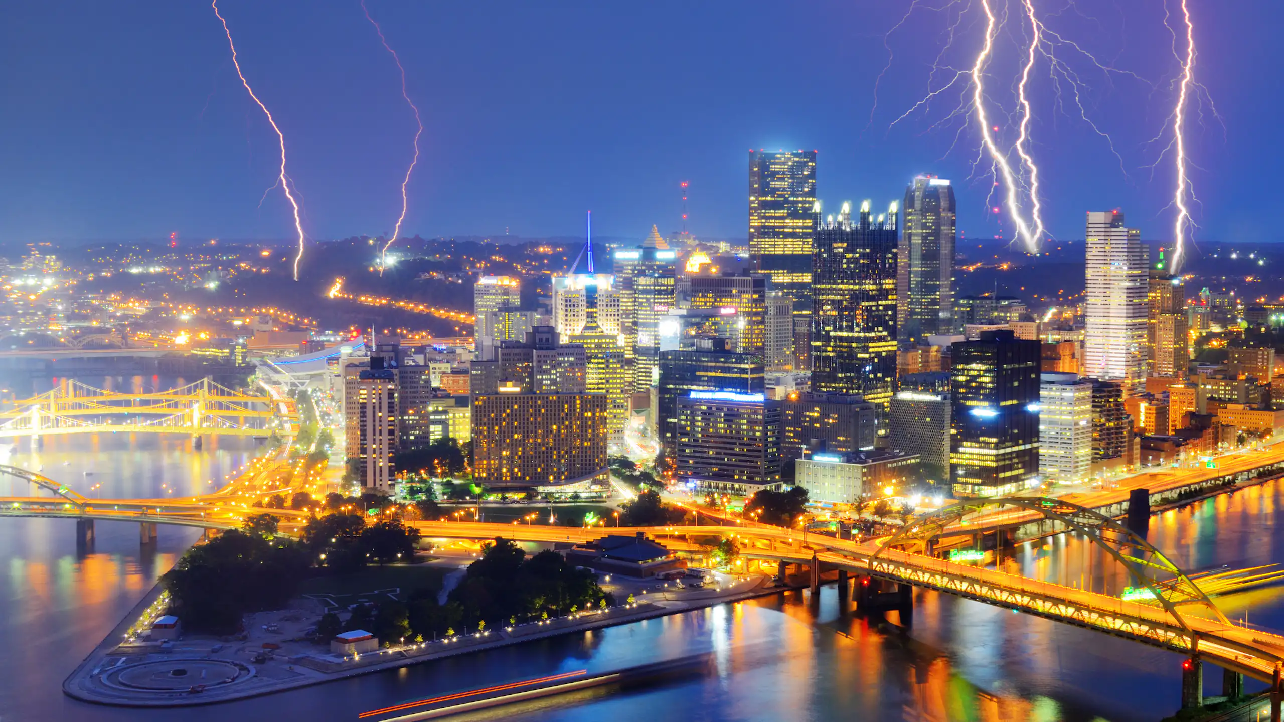 Lightning in the sky above a city at night.