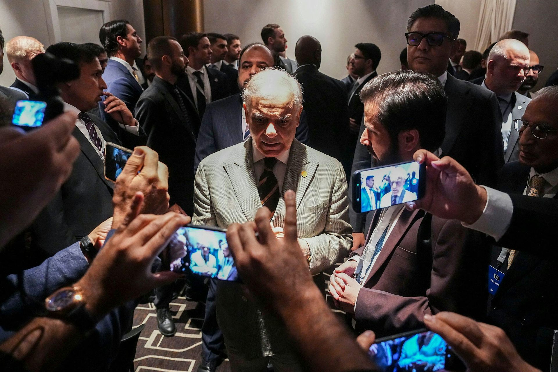 Pakistan's prime minister, Shehbaz Sharif, talks with journalists