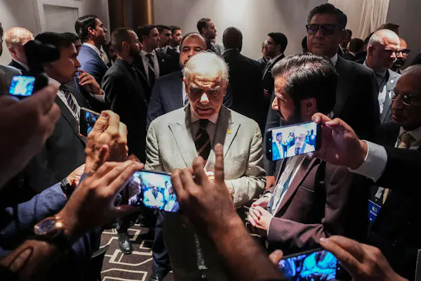Pakistan's prime minister, Shehbaz Sharif, talks with journalists