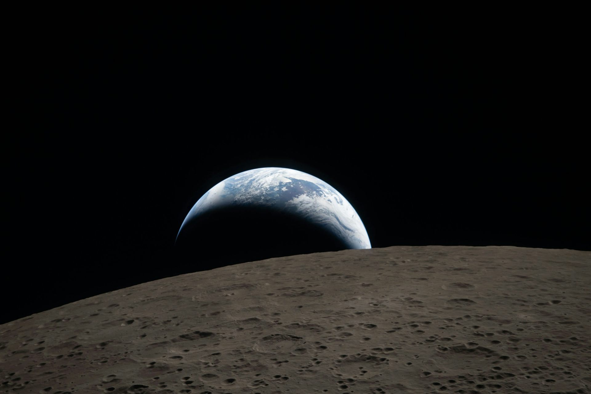Earth sets behind the moon.