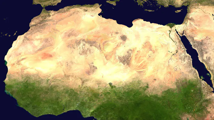 satellite image of the northern part of the African continent, starting gold and brown and looking green further south