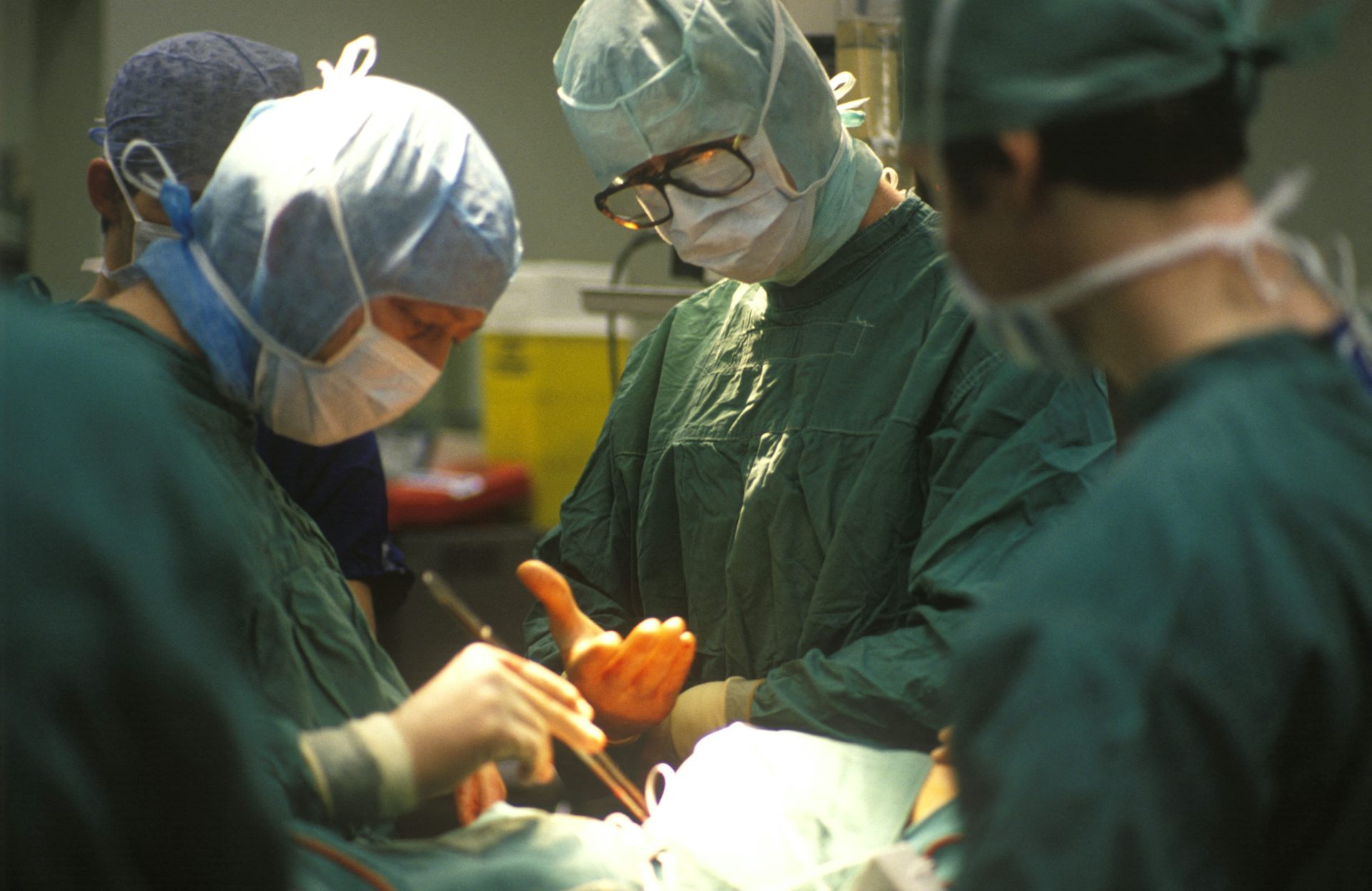 Surgeons performing heart surgery