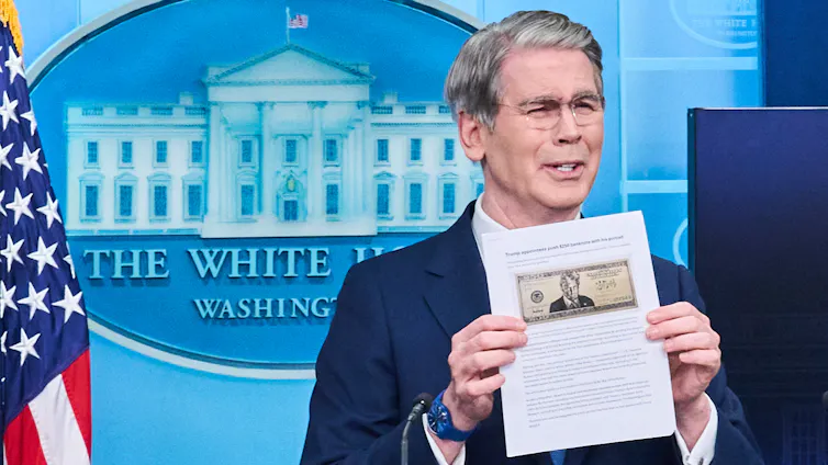 Treasury Secretary Scott Bessent holds up a document featuring a proposed $250 banknote with Donald Trump's portrait