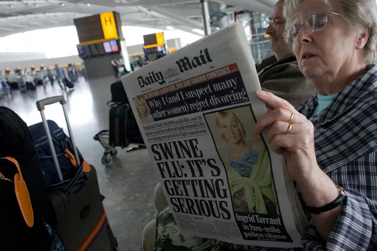A woman reading the Daily Mail