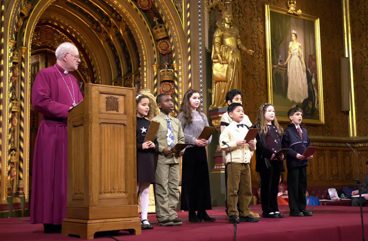 George Carey with some choirboys