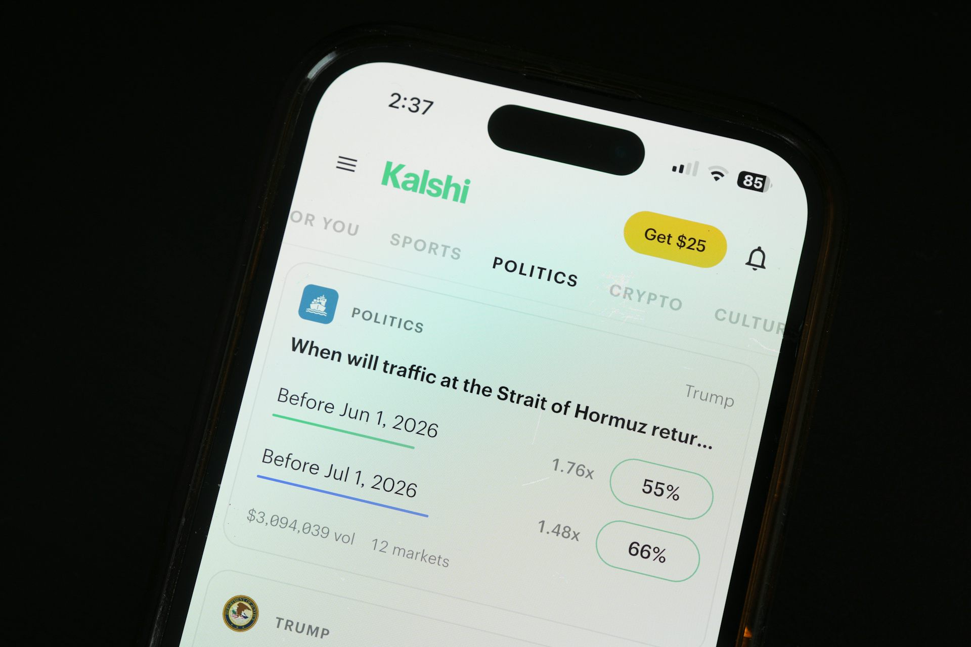 The Kalshi app open on a phone. On screen, a poll is up for the question: When will traffic at the Strait of Hormuz return to normal?