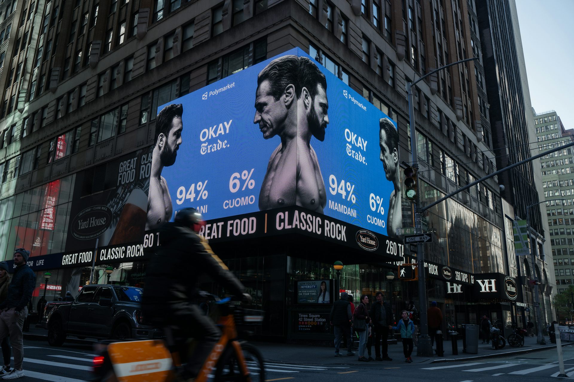 A digital advertisement showing two men facing one another with the text Mamdani 94% and Cuomo 6%