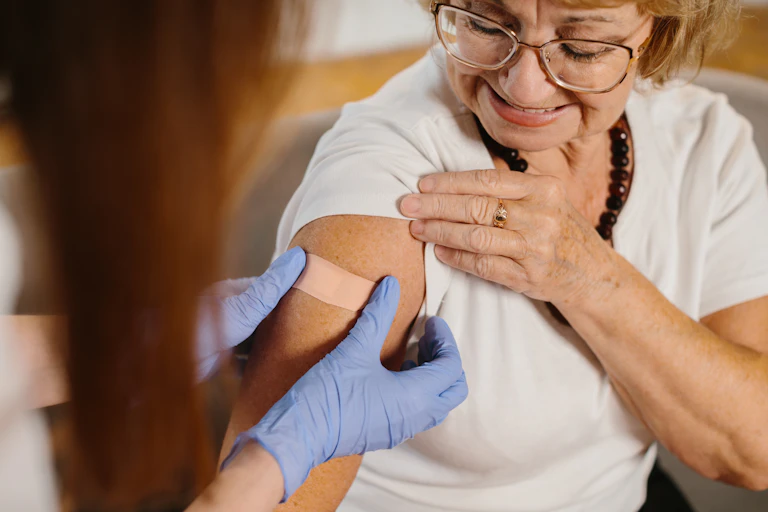 Older woman gets a COVID vaccine