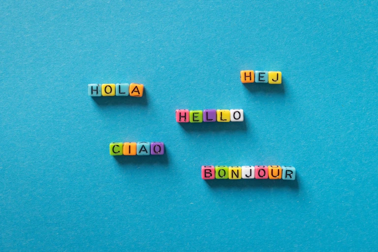 Hello in different languages on a blue background.