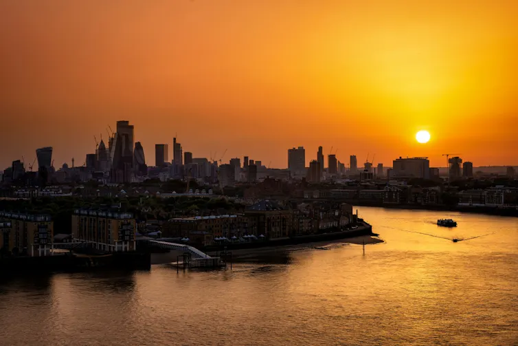 The sun setting over London.
