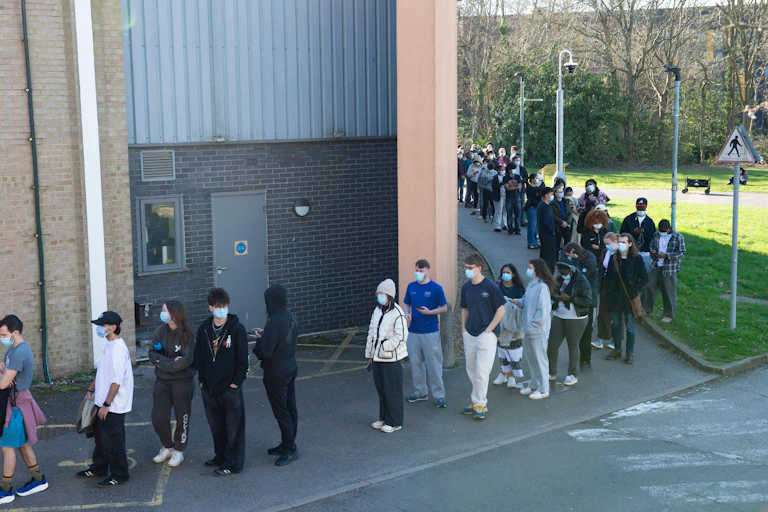 Students in Kent queueing to get the MenB vaccine.