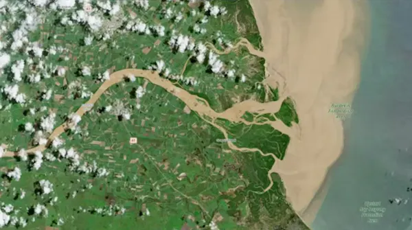 satellite image showing plume of floodwater going out into ocean.