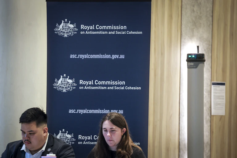 Officials can be seen outside the venue of the Royal Commission on Antisemitism and Social Cohesion in Sydney.