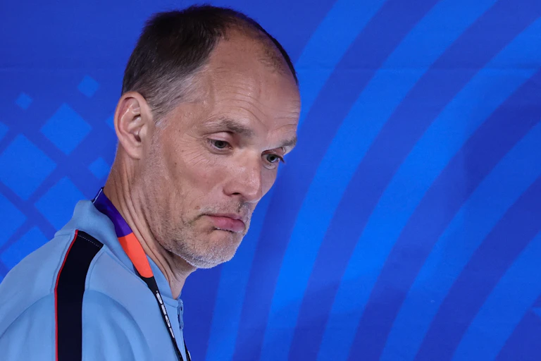 Thomas Tuchel against blue backdrop with World Cup 2026 logo.