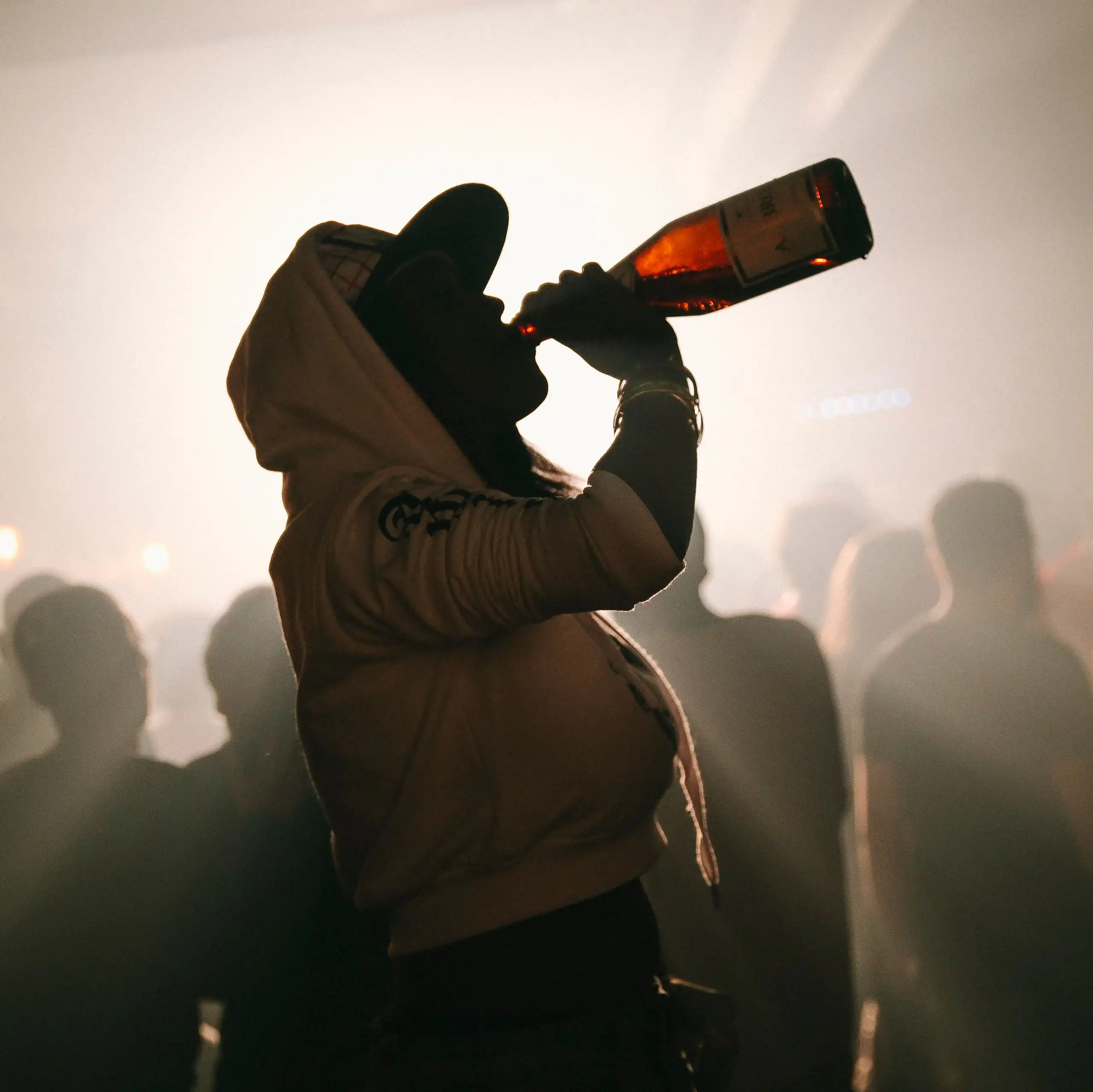 Woman drinking wine from the bottle