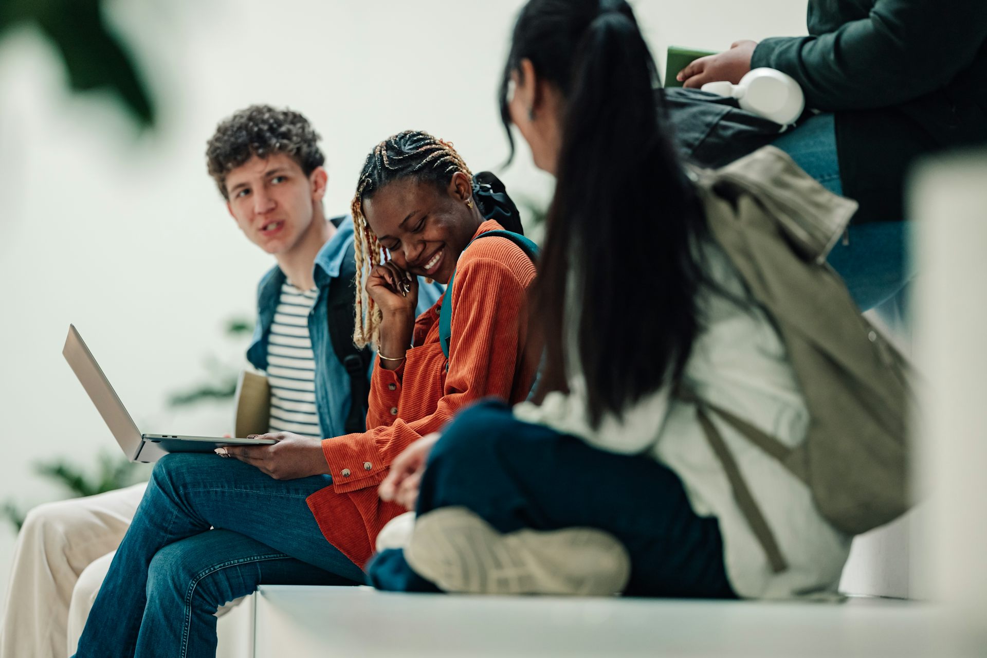 Group of teens sat on steps