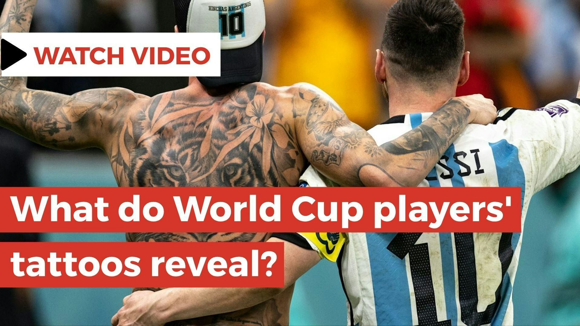 Two soccer players put their arms around each other's shoulders. One player is shirtless and his tattoos are visible. There is text that says, "Watch video" and additional text that says, "What do World Cup players' tattoos reveal?"
