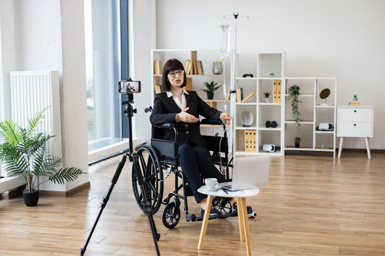 A health influencer in a wheelchair talking to the camera.