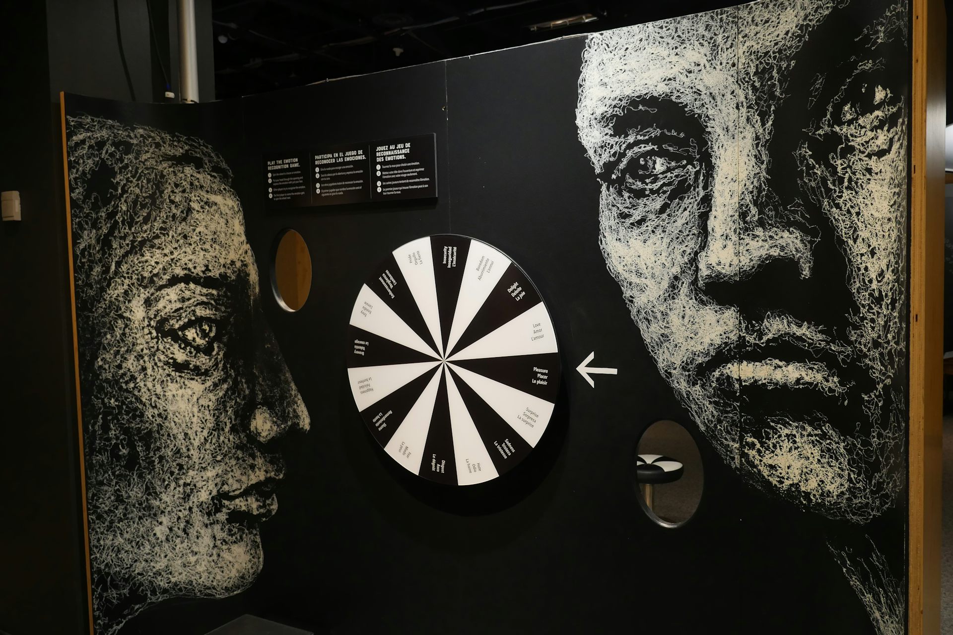 Two facese illustrated in white against a black backdrop with pensive and possibly disturbed expressions.   