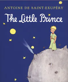 A blue book cover of The Little Prince by Antoine de Saint Exupery