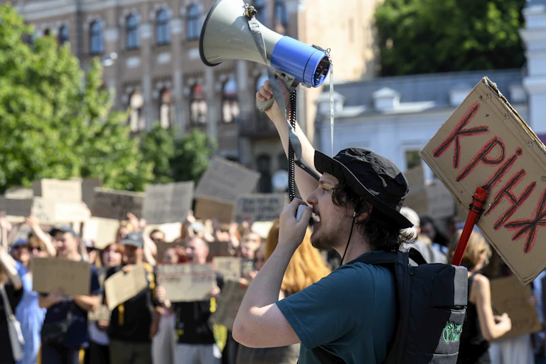Ukrainians protest against the dismissal of the country's defence minister, Mykhailo Fedorov, in Kyiv.
