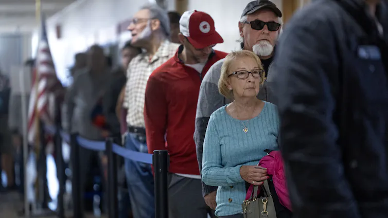 Residents of different ages wait in line to vote in Kenosha, Wisconsin, in 2024.