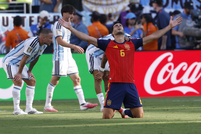 Mikel Merino of Spain celebrates their victory against Argentina.