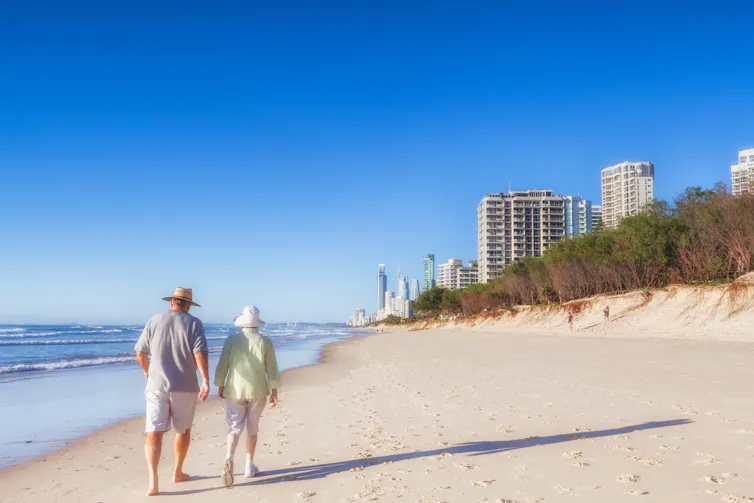 Couple walking along beach