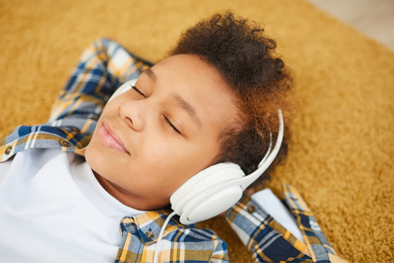 Boy relaxing listening to music