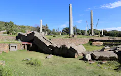 Tall stone columns. One has fallen