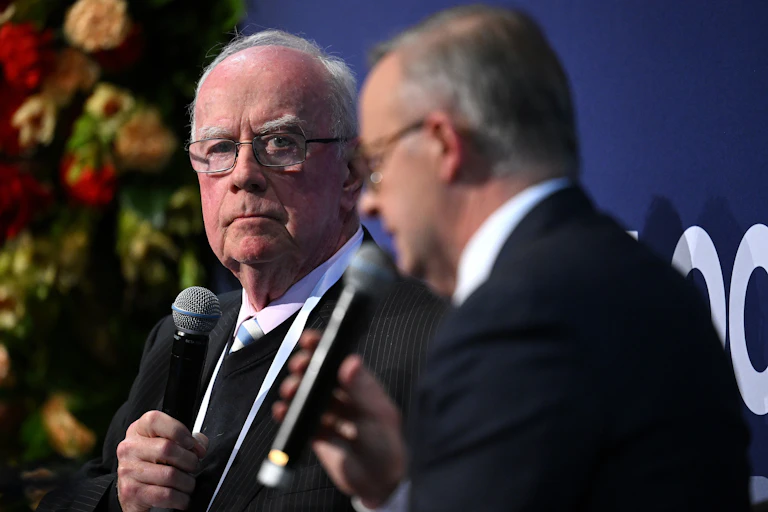 Editor-at-Large of The Australian Newspaper, Paul Kelly, speaks with Prime Minister Anthony Albanese at a conference in Melbourne, November 2022.
