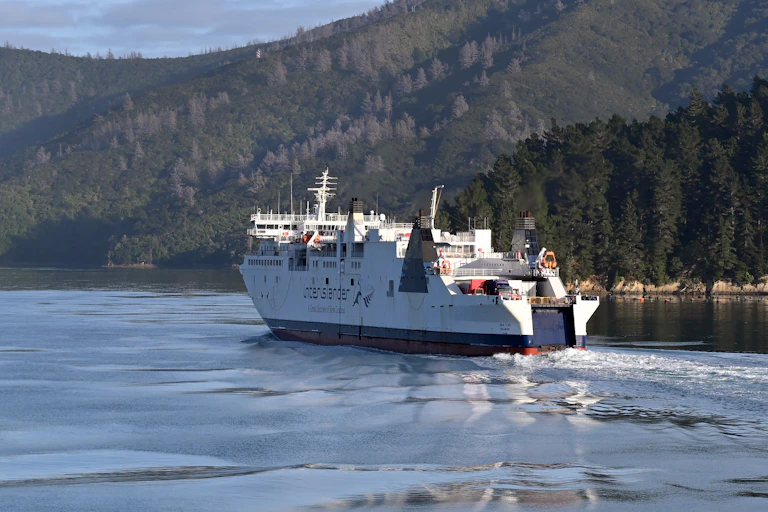 Interisland ferry in Marlborough Sounds with hills in background