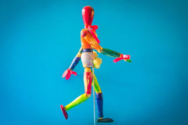 A multicoloured wooden puppet