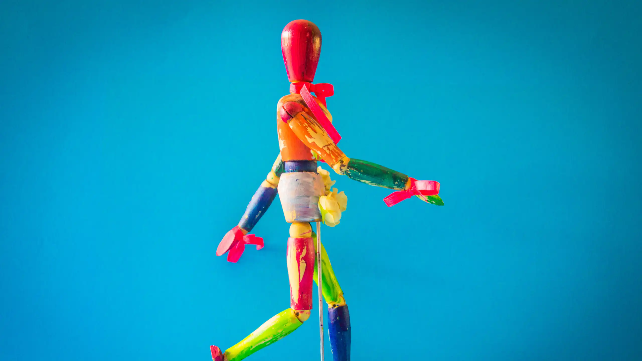 A multicoloured wooden puppet
