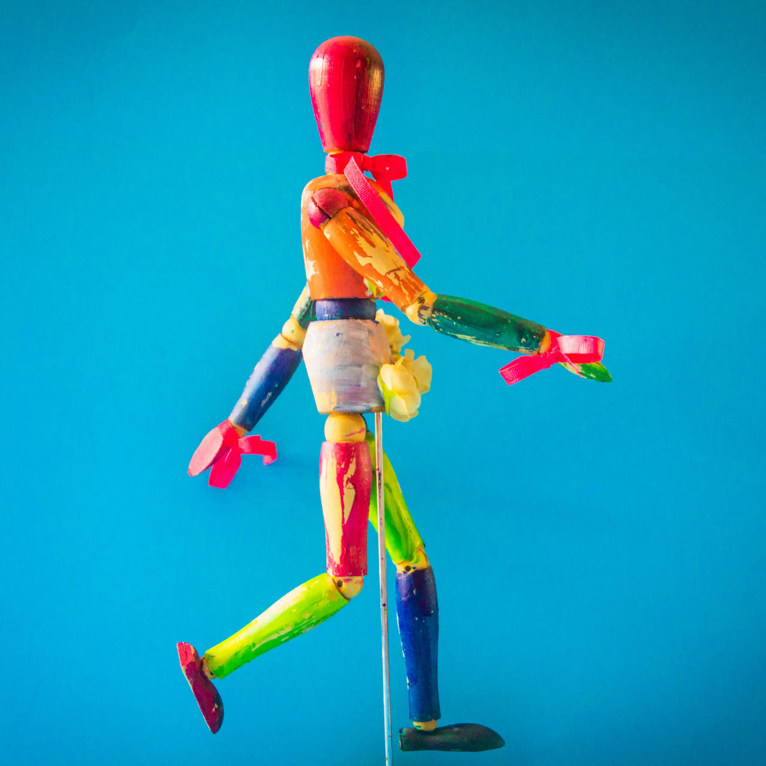 A multicoloured wooden puppet