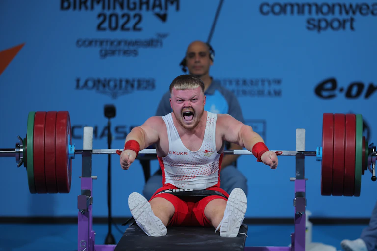 England's Mark Swan celebrates a lift during the men's Lightweight Para Powerlifting on day seven of the Commonwealth Games