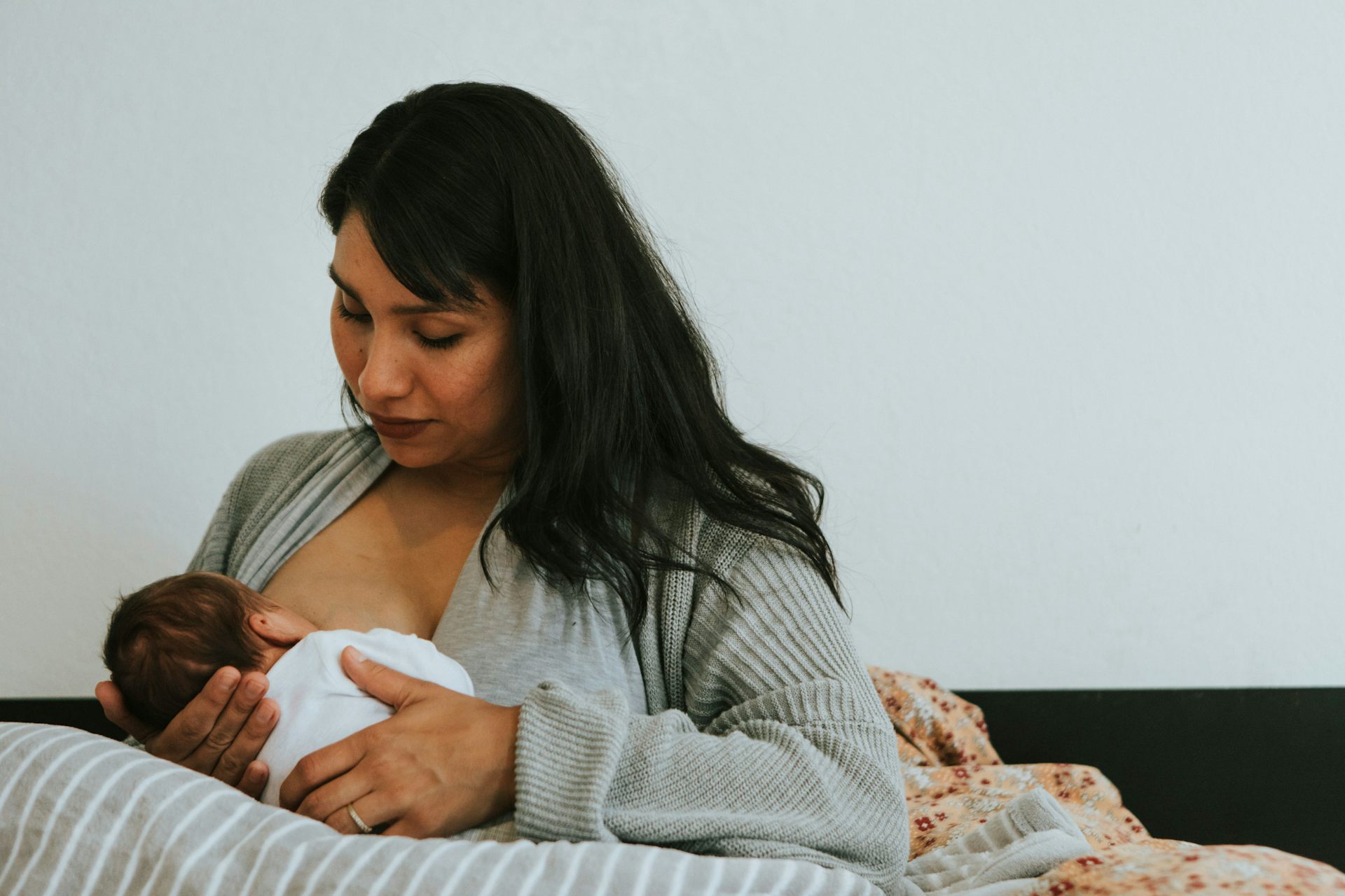 A woman breastfeeding an infant