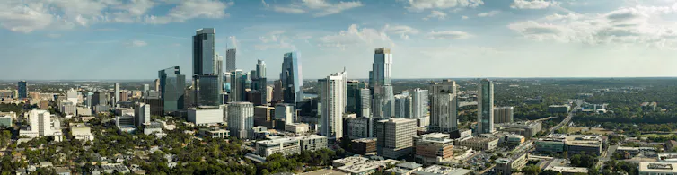 An aerial view of downtown Austin, Texas, with high-rise towers