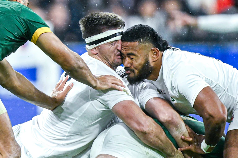 Close-up of the heads of two rugby players colliding during a match