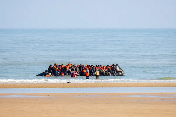 Small boat of migrants leaving Sangette