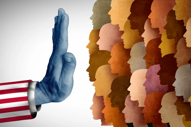 A hand representing the U.S. signals that it's blocking the arrival of a diverse group of people in a graphic design image.