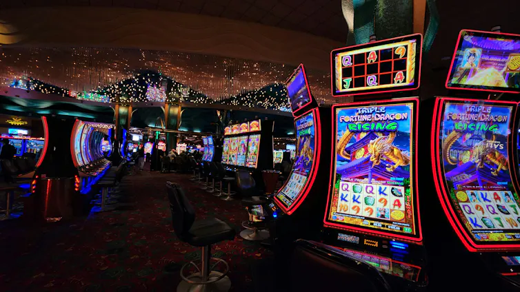 A room full of brightly coloured poker machines