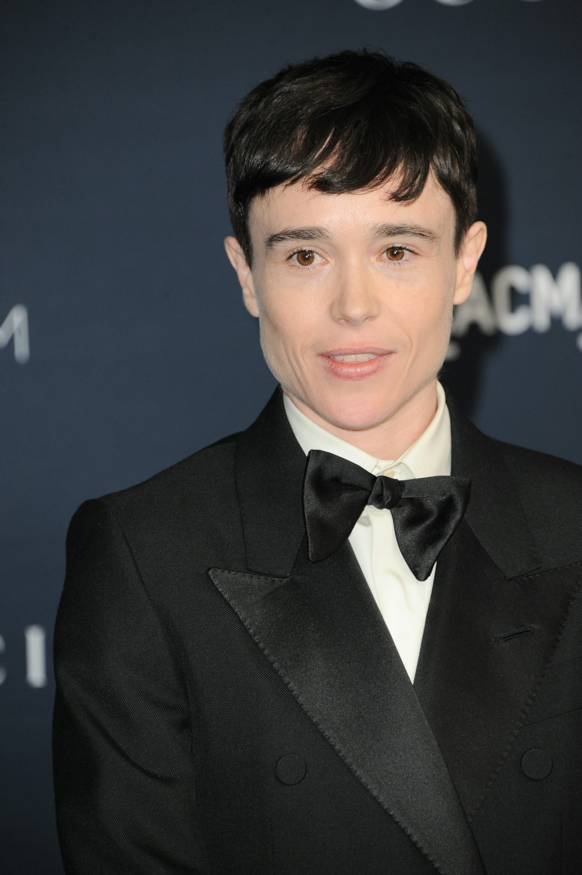 A young actor dressed in a tux.