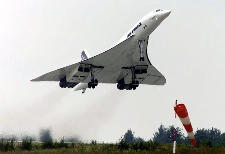 A photo showing a jet with a triangular shape taking off