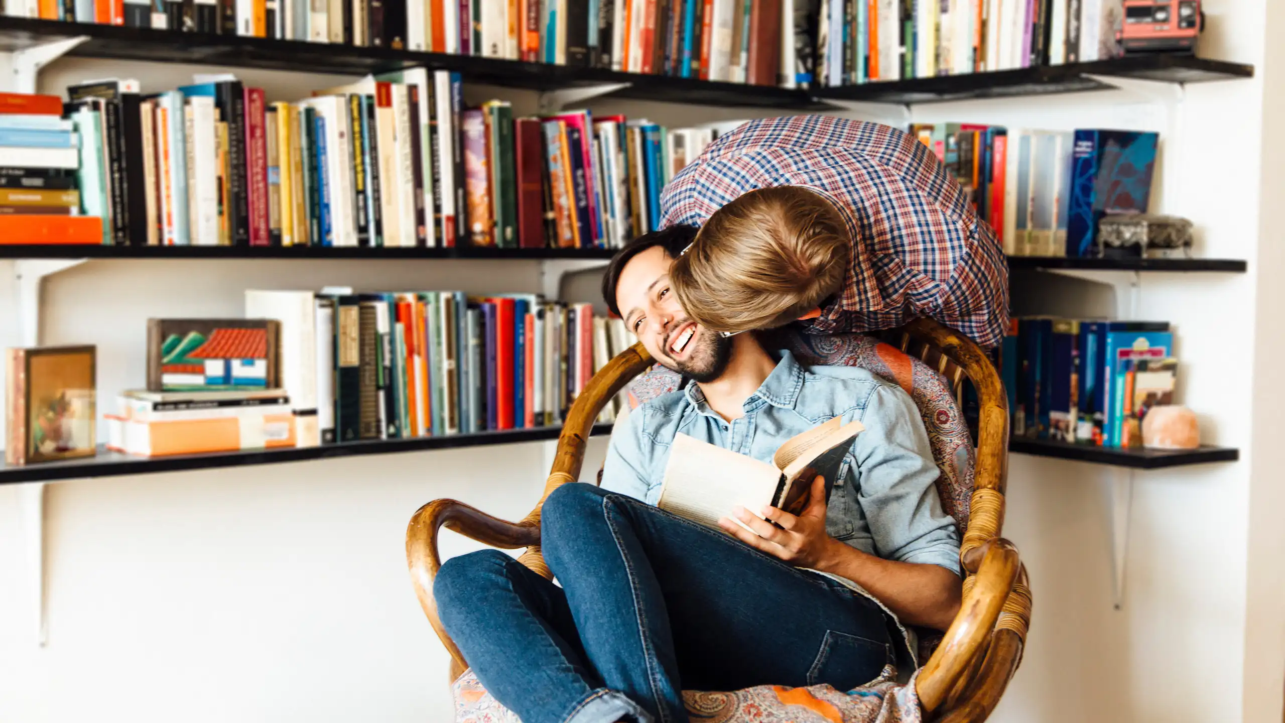 Male couple at home, fooling around, laughing